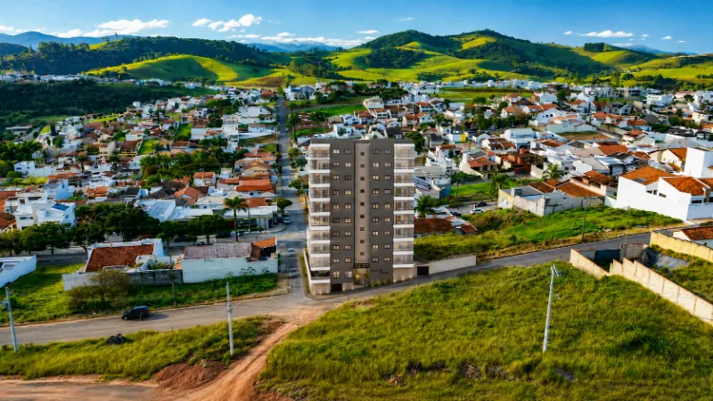 Vista aérea do bairro Altaville em Pouso Alegre, com o Residencial AltaVille no centro, ruas de casas baixas em volta e a serra ao fundo