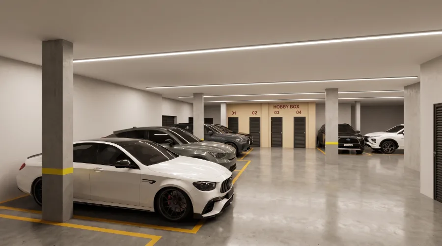 Garagem coberta com as portas numeradas dos depósitos privativos Hobby Box ao fundo